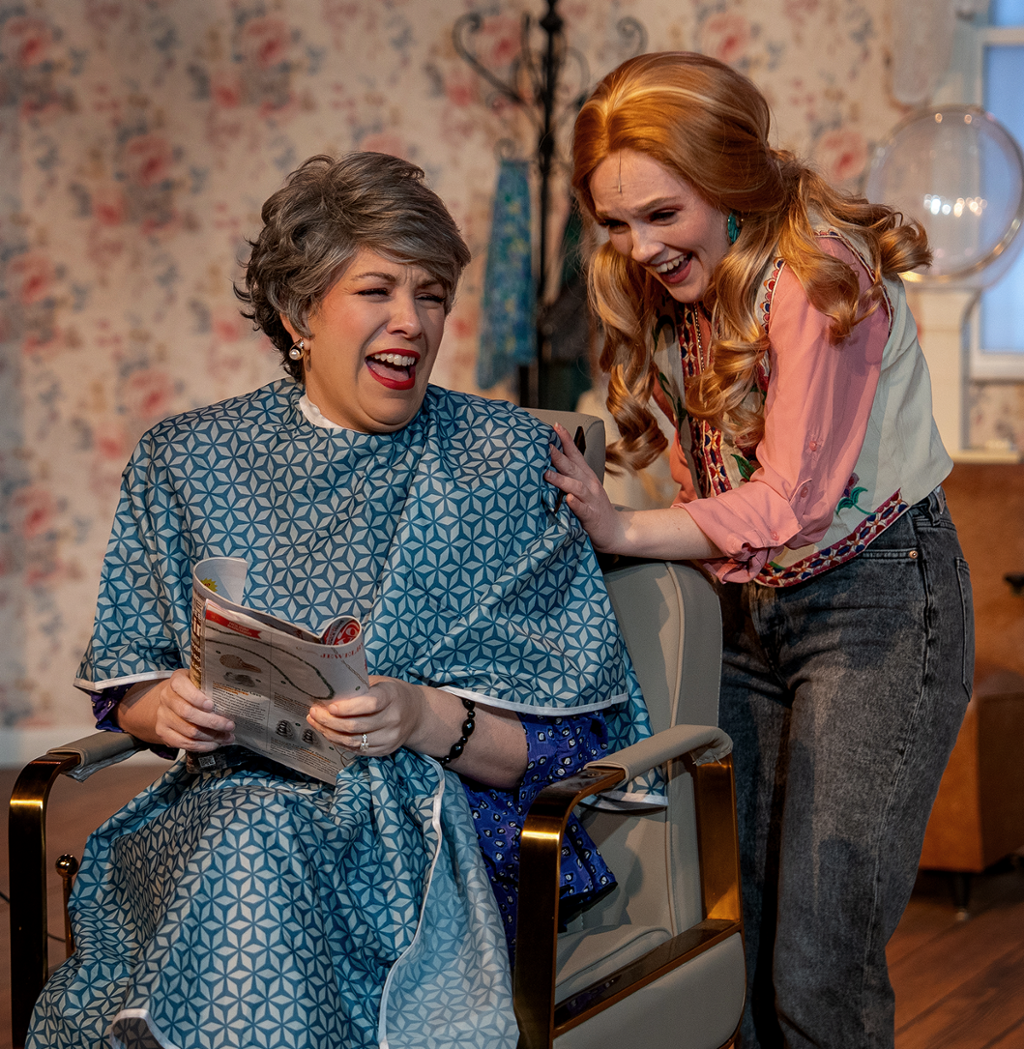 two characters in a beauty shop laughing