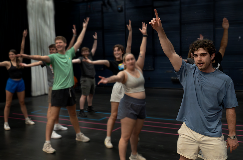a group of actors dancing