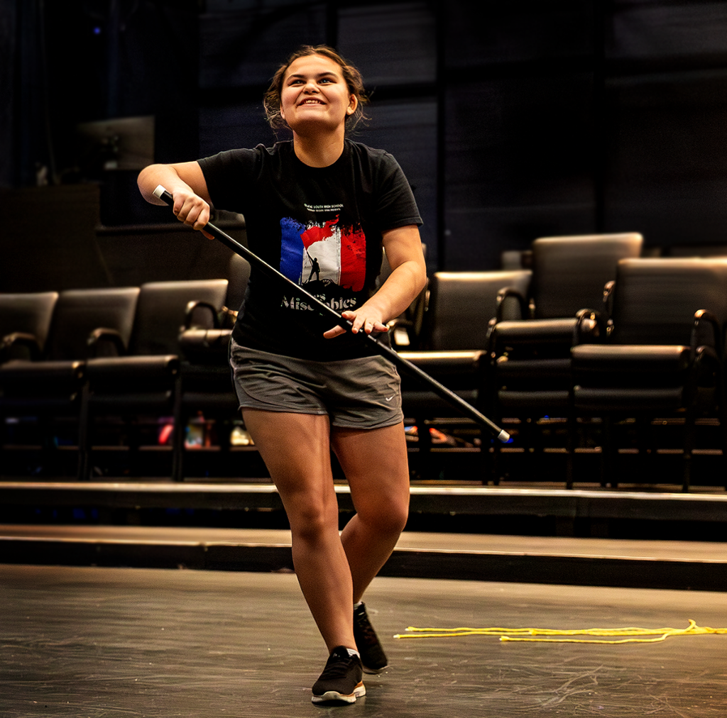 Girl dancing with a cane