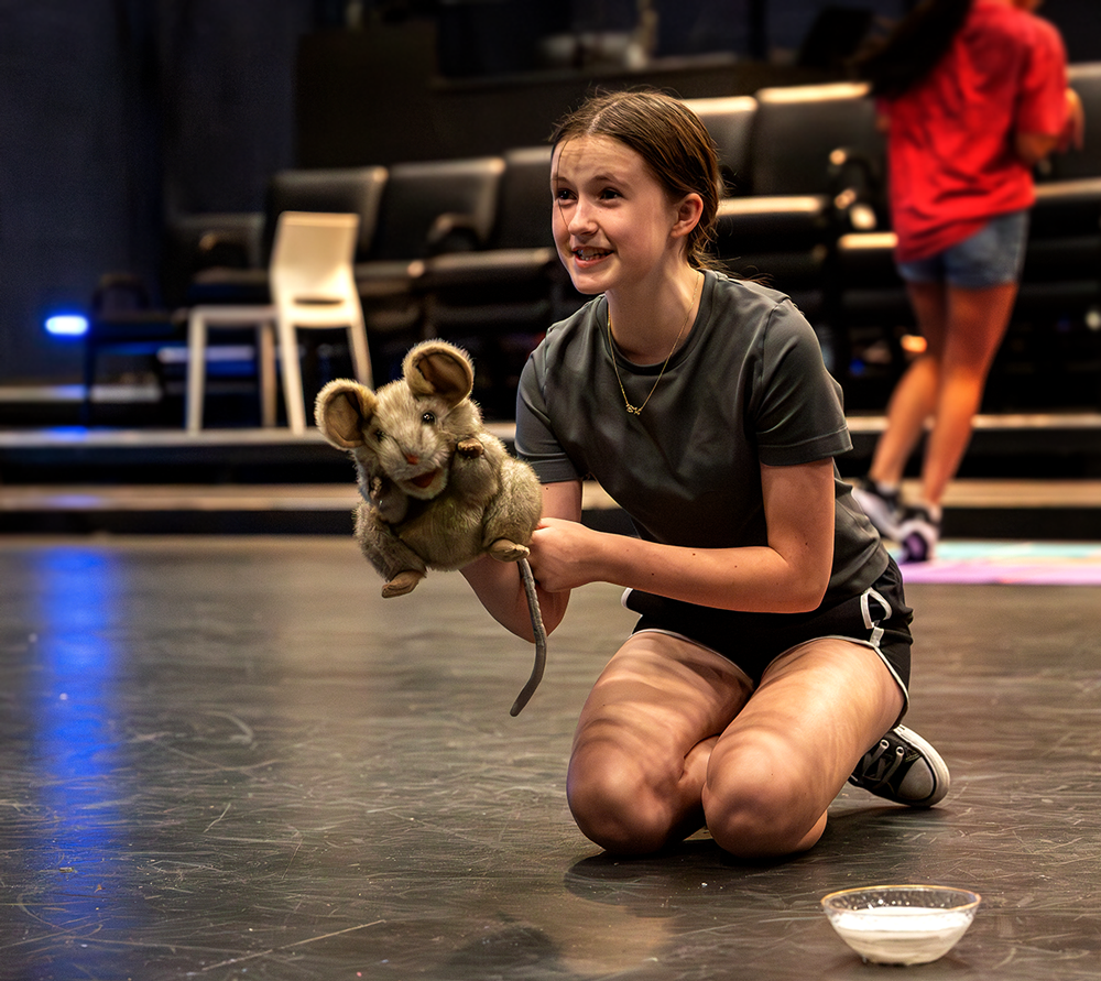 girl with a mouse puppet