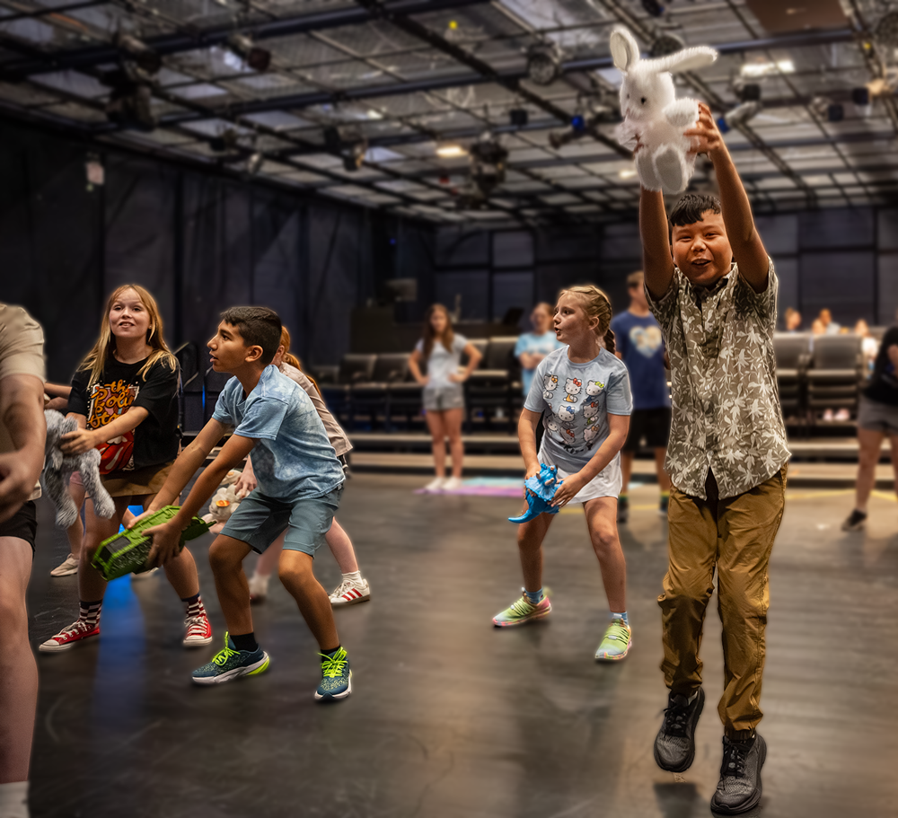 Kids acting and dancing in a scene