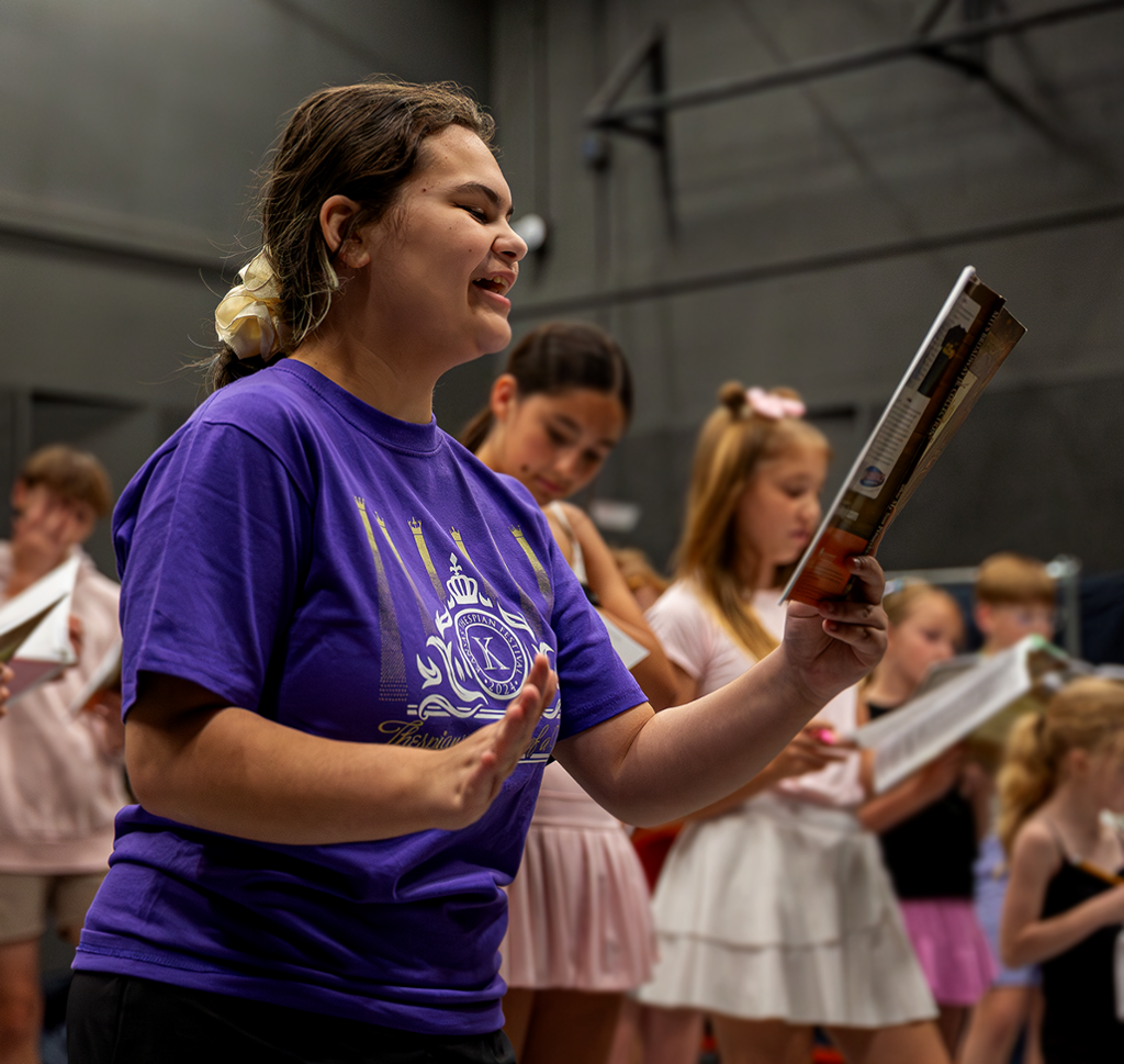 Kids in a singing rehearsal