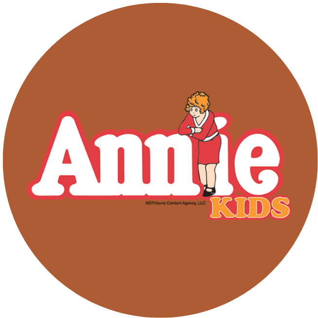 Annie Kids logo on a dark orange circle graphic