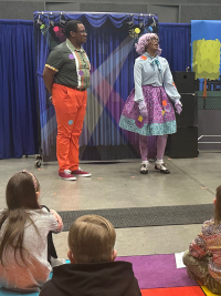 Lily Polkadot and Sky Square perform for an audience of children