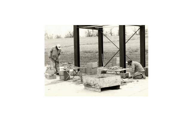 Workers constructing the stage towers.